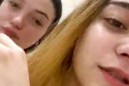 Two girls in bat, one show nipslip